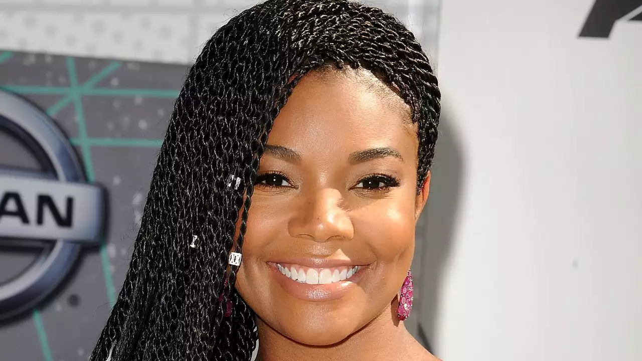 Gabrielle Union Wears Butt-Length Braids in the Pool — and Nothing Else