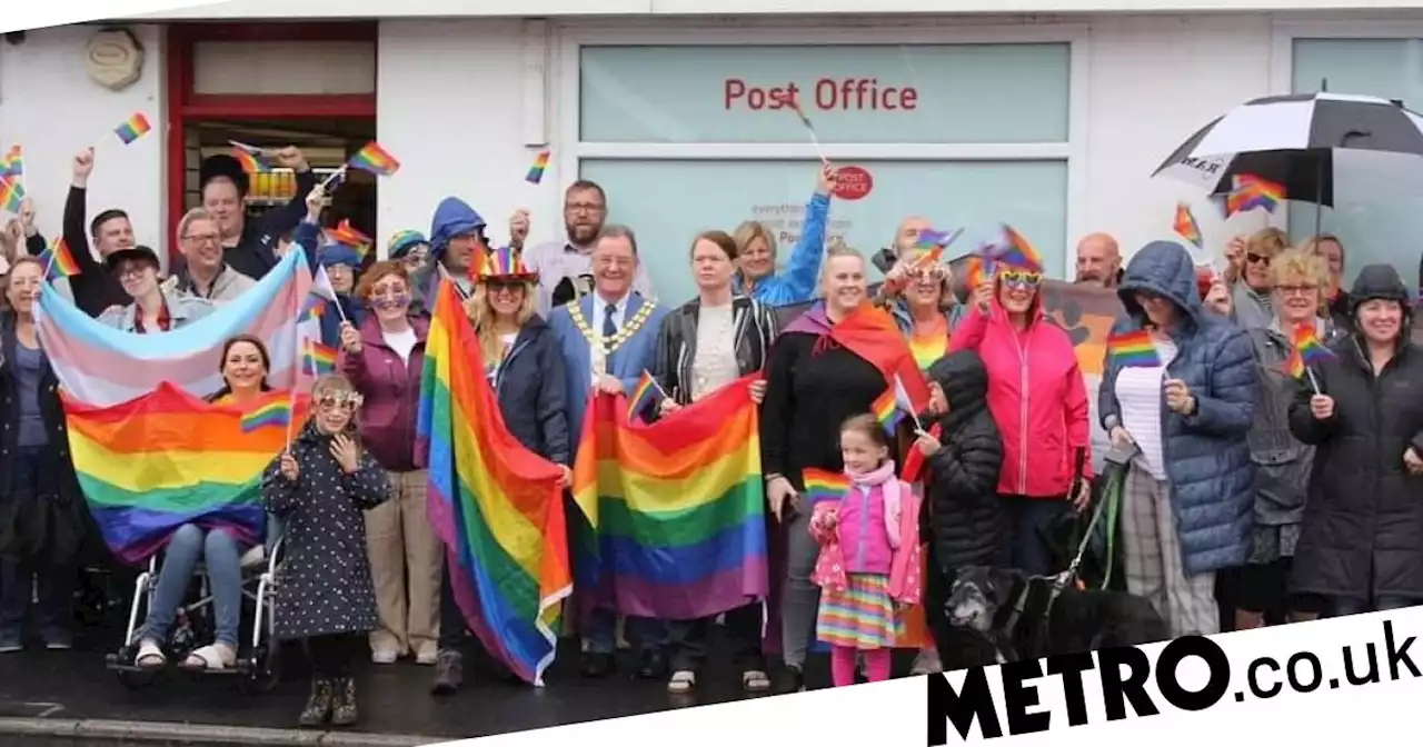 Villagers support gay couple sent homophobic letters for Pride flag outside shop