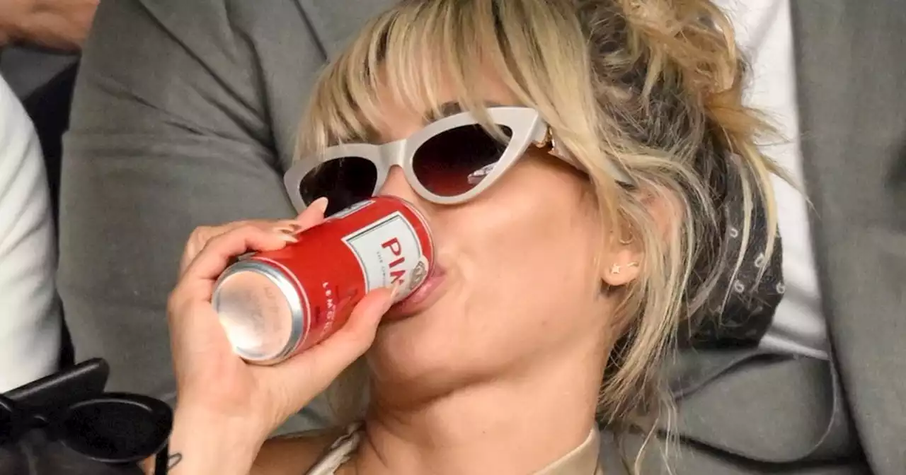 Ashley Roberts knocks back Pimm's as she joins other celebs at Wimbledon