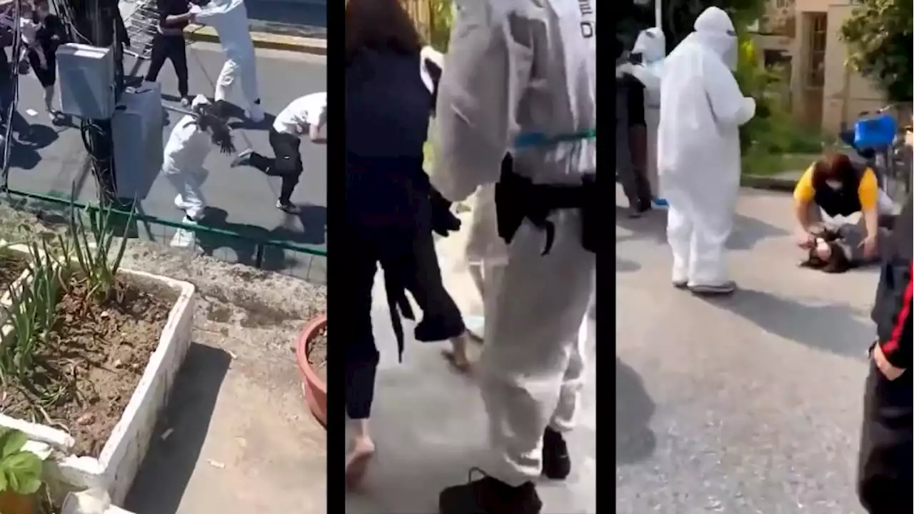 Videos show Chinese Covid workers allegedly harassing and beating residents - CNN Video