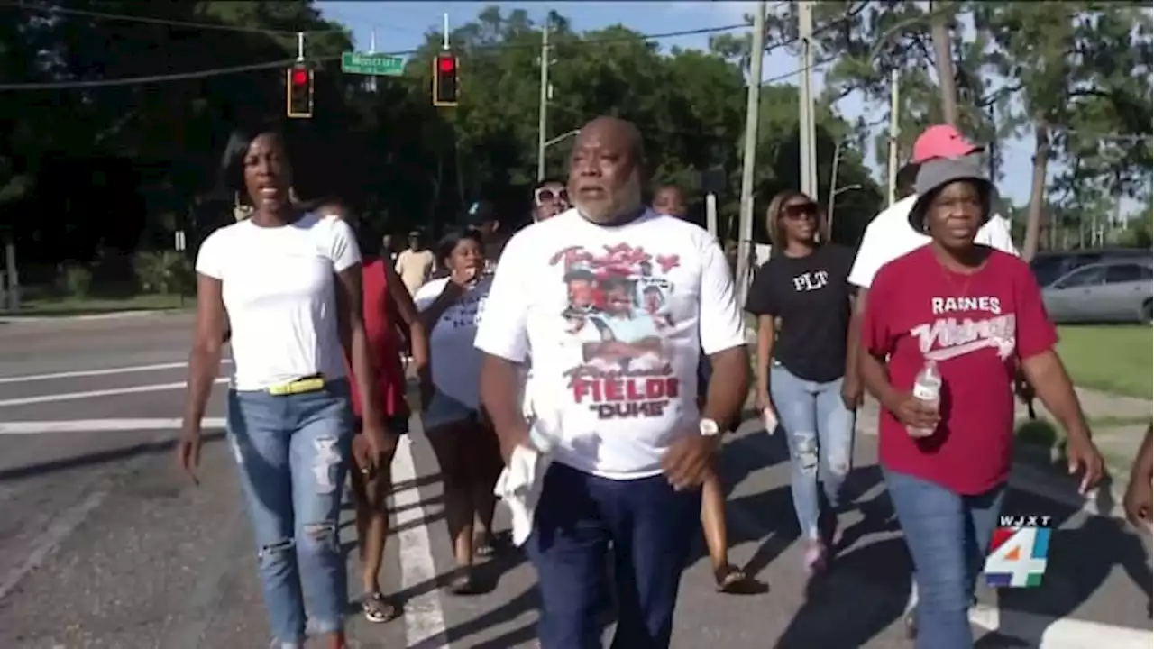 Loved ones march in memory of slain Raines football star