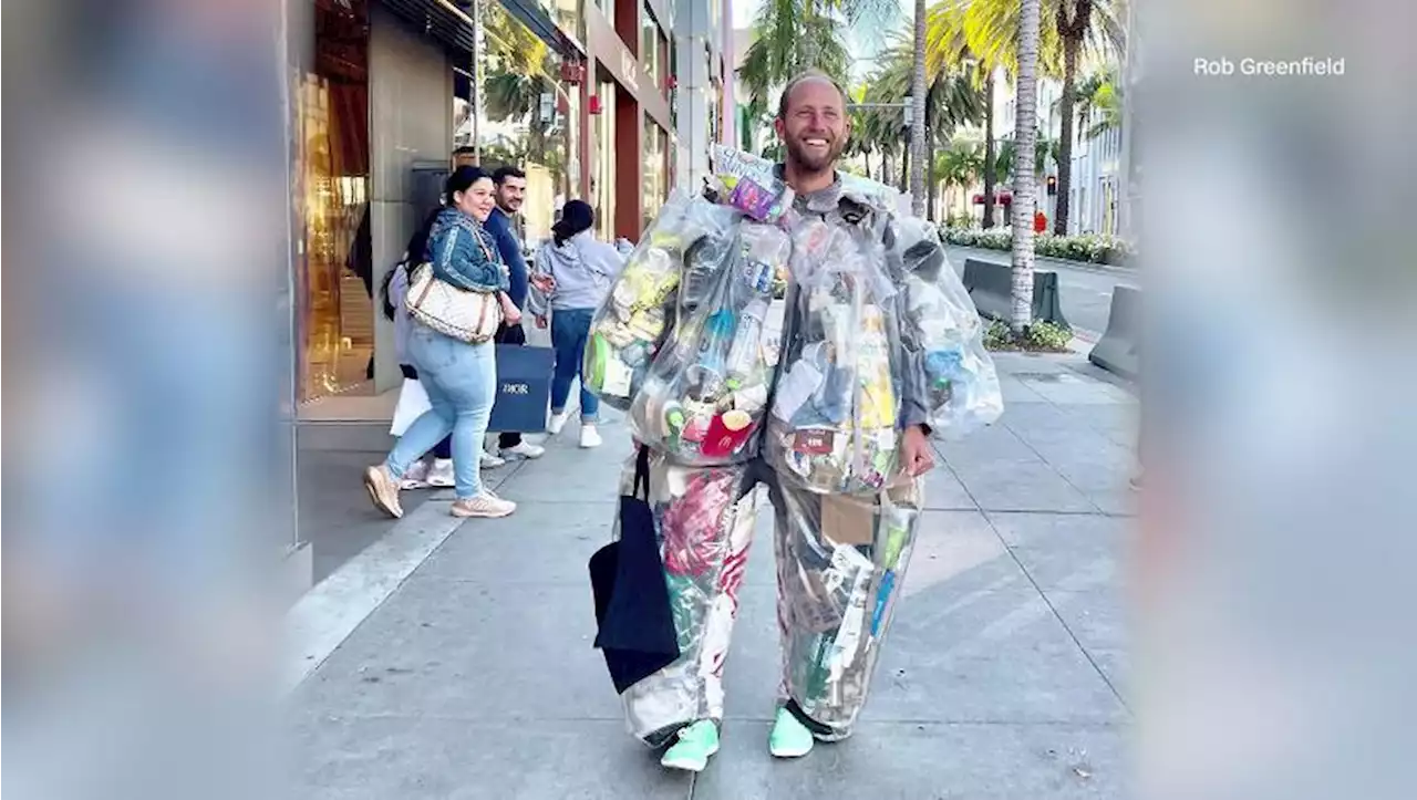 Man turns heads with 100-pound suit made of trash