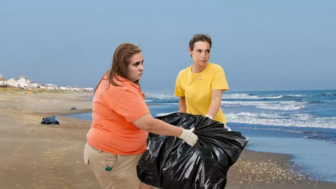 Rescuers Heroically Help Beached Garbage Back Into Ocean