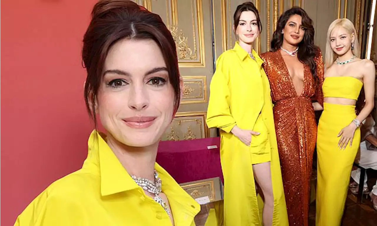 Anne Hathaway channels radiance in yellow shorts and overcoat combo