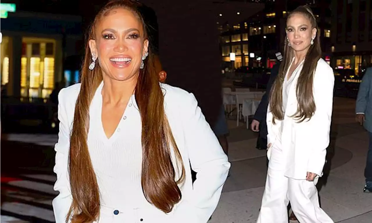 Jennifer Lopez looks effortlessly chic in a white trouser suit