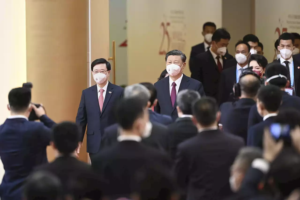 China's Xi swears in new Hong Kong leader John Lee