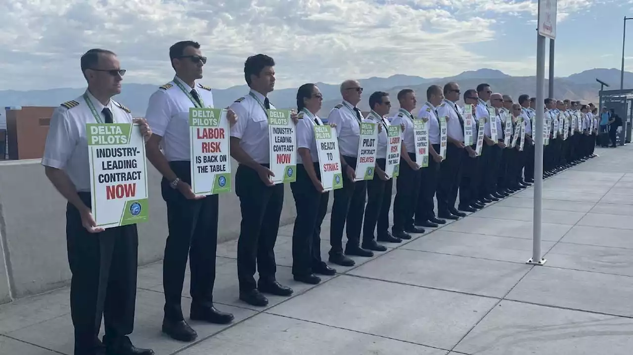 Delta pilots picket across the country as busy travel weekend begins