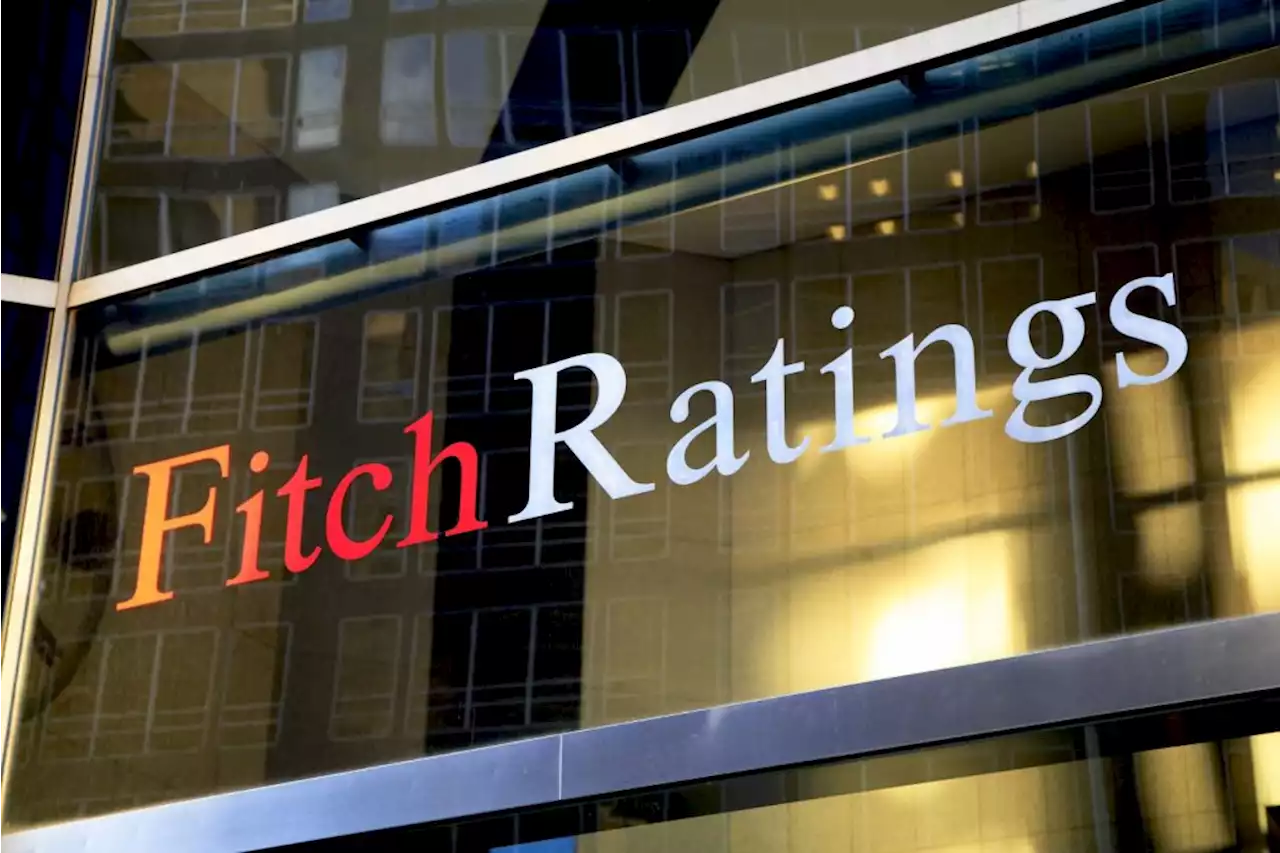 Fitch cuts view on global sovereign debt