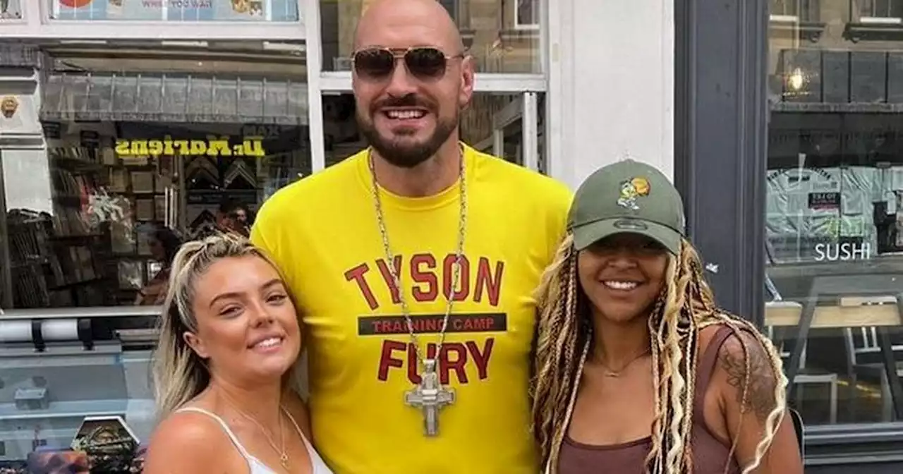 Tyson Fury dances in street and takes his top off as he eats lunch