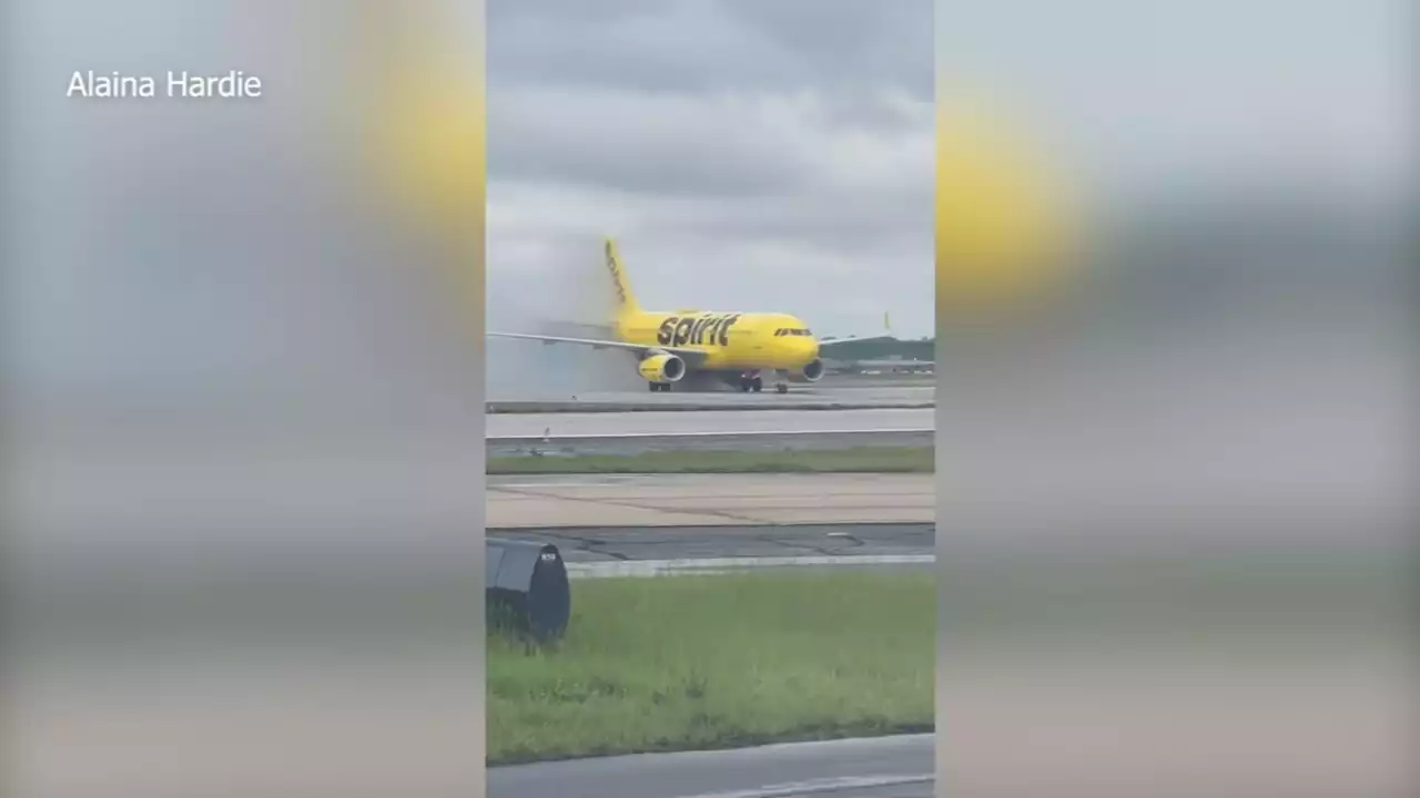 Spirit plane towed after brakes overheat, ignite