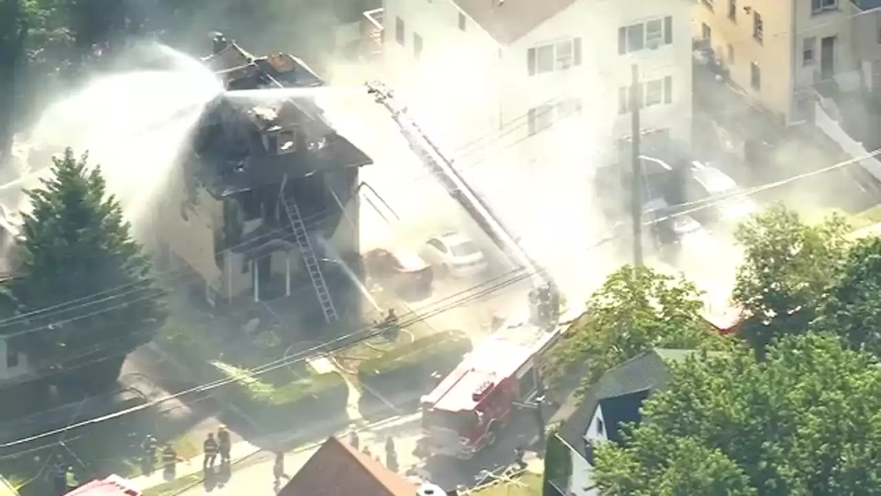 Fire guts multi-family home in NY, at least 1 jumps from 3rd-story window