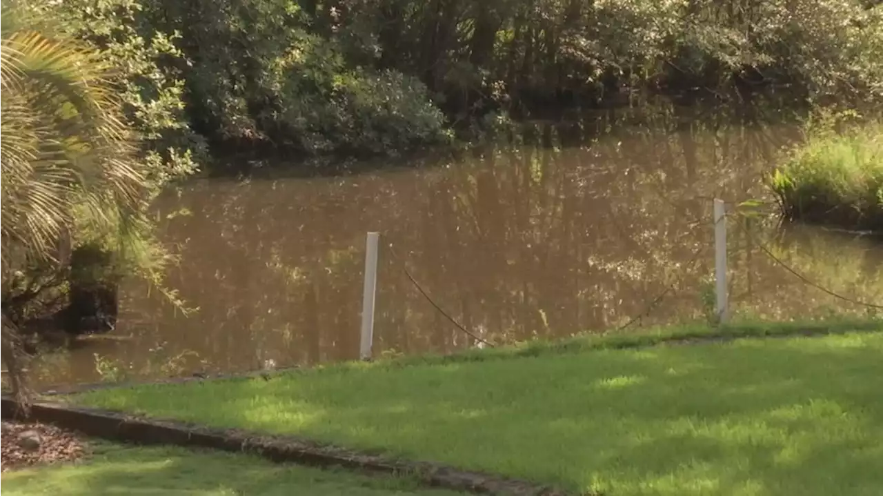 Homeowners in the Bayou Sara community preparing for rainy week