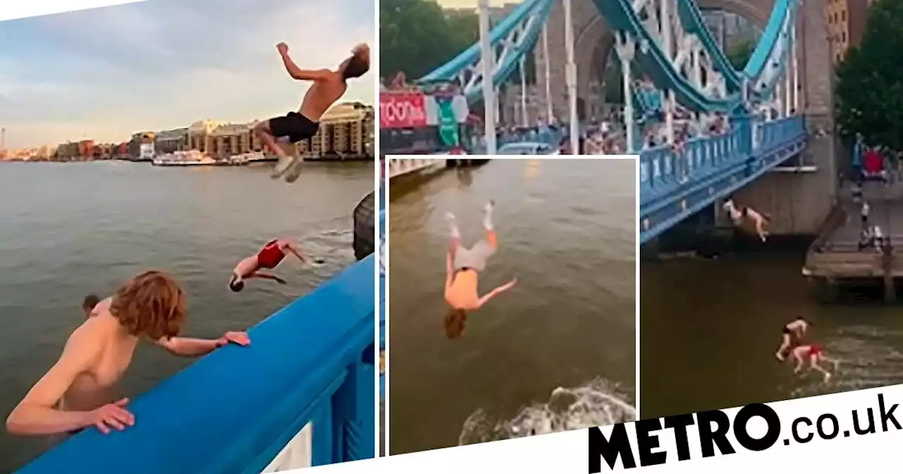 Daredevils jump off Tower Bridge and seeing the water we aren't at all jealous