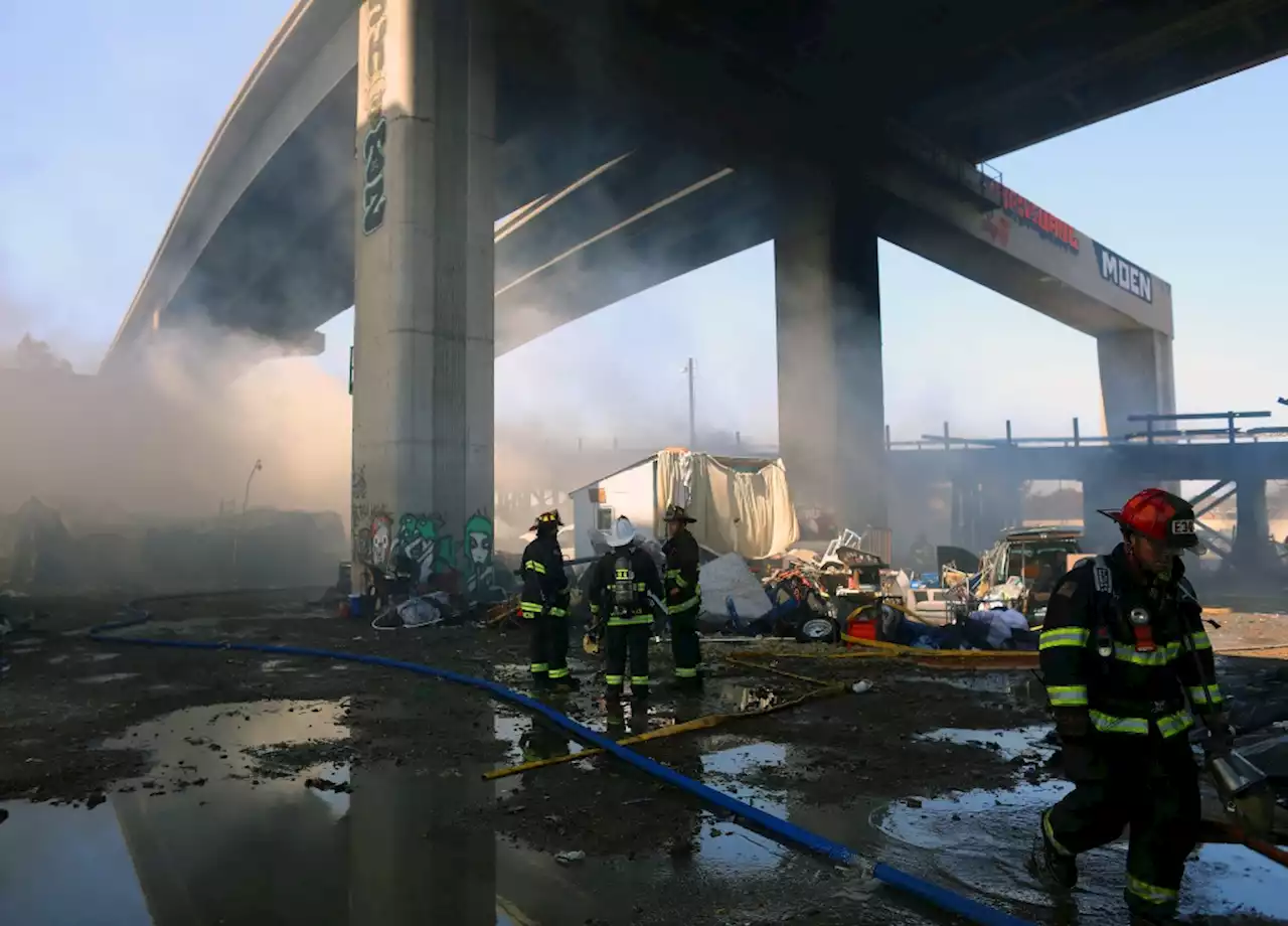 Homeless camp fire in West Oakland shuts down freeways, railroad service