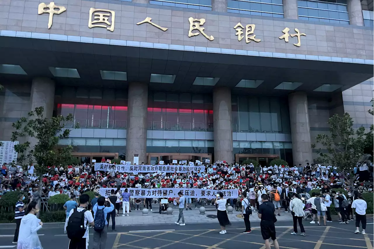 China detains alleged bank fraud 'gang' after rare mass protests | The Citizen