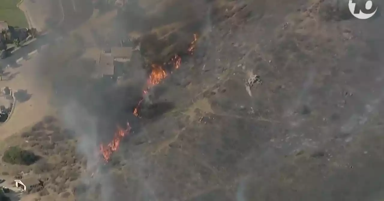 Brush fire near Dehesa sends thick, black smoke into the air