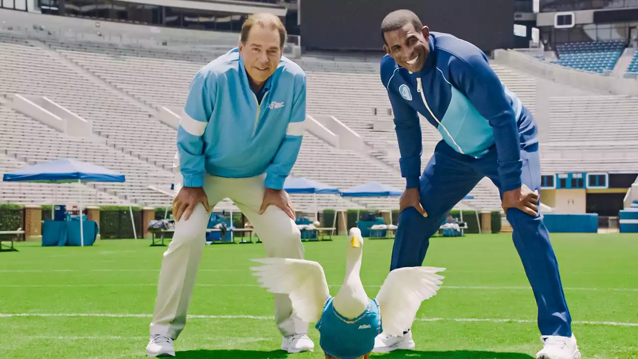 Watch Nick Saban, Deion Sanders mock NIL beef on AFLAC set