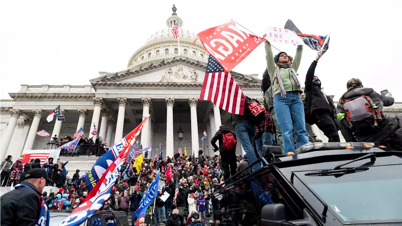 Capitol rioter who shoved officer with Confederate flag gets 5-month prison sentence