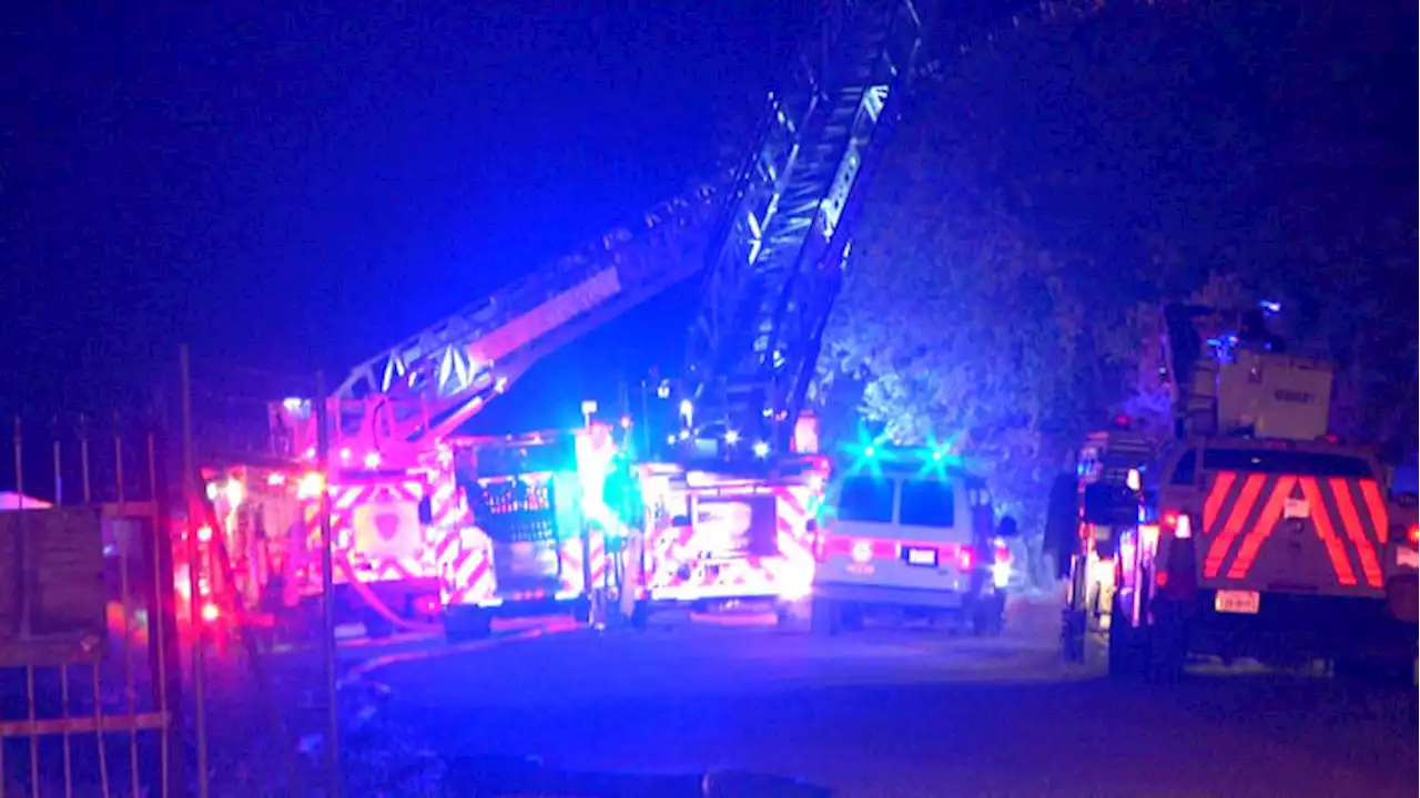 Firefighters battle heavy flames at auto repair shop and storage facility on South Side