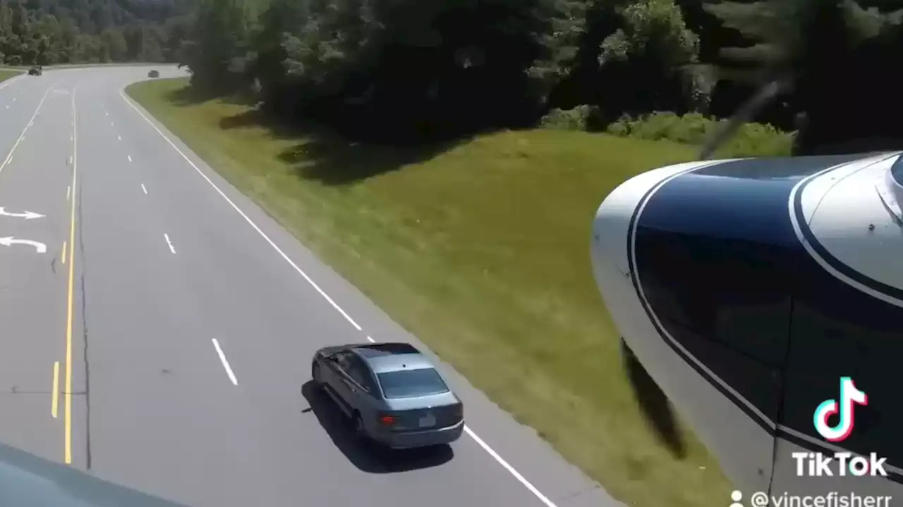 Watch a Badass Pilot Dodge Cars to Land on Curvy Highway