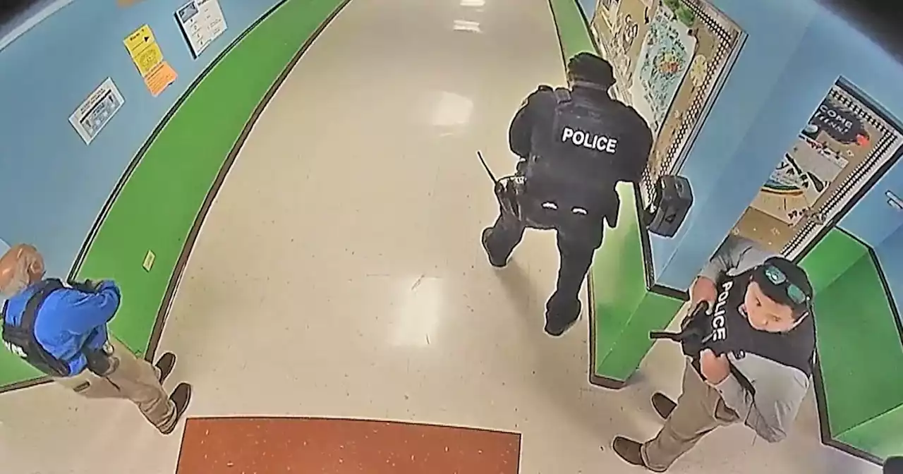 Video from inside Uvalde school shows officer running from classroom where gunman killed 21