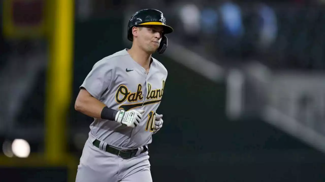 Pinder’s 12th-inning slam lifts A’s over Rangers 14-7