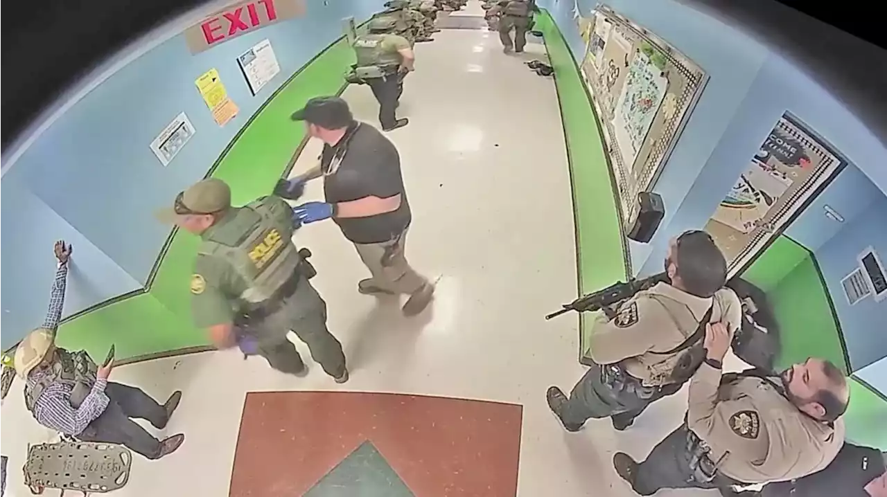 Watch: New Uvalde Footage Shows Cops Standing by in Hallway