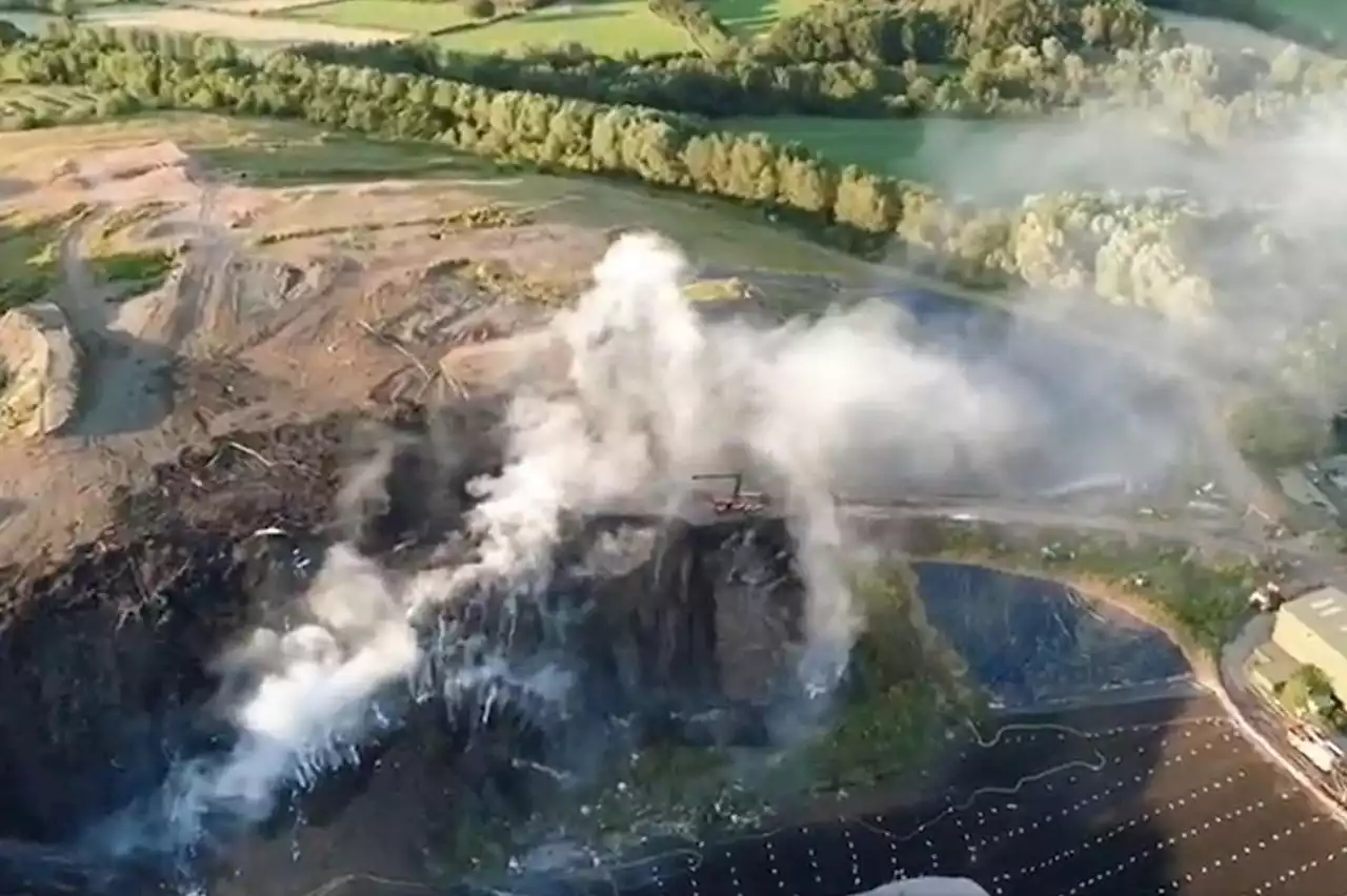 Drone footage shows scale of blaze at landfill site as firefighters continue to battle the flames