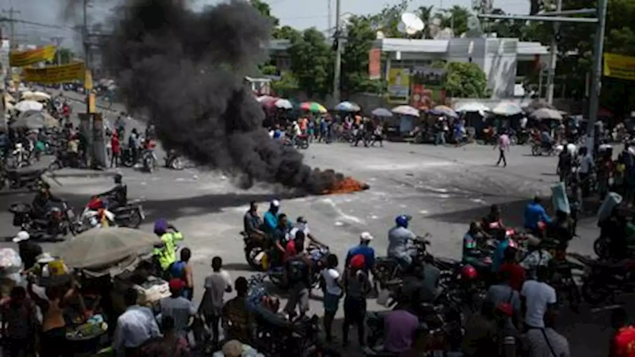 Rival gangs in 'battlefield' Haiti suburb kill dozens