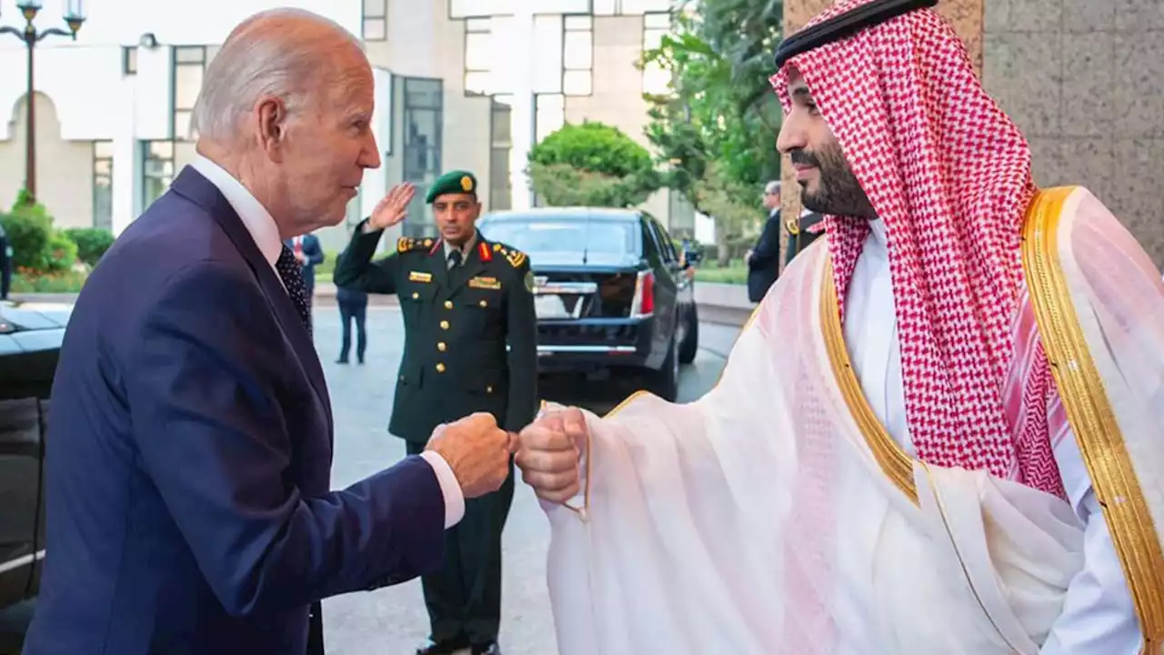 Biden greeted at the royal palace in Jeddah with a fist bump by Saudi Crown Prince