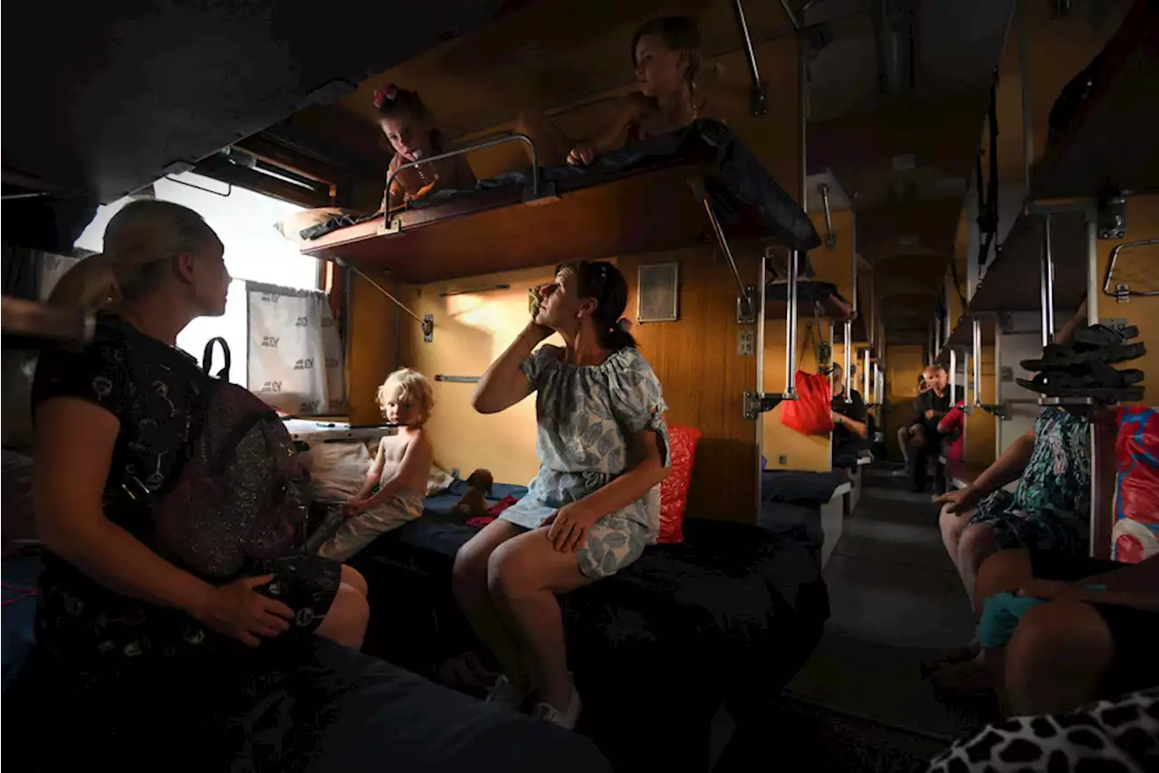 Riding Ukraine's last train line out of Donbas with families fleeing for their lives