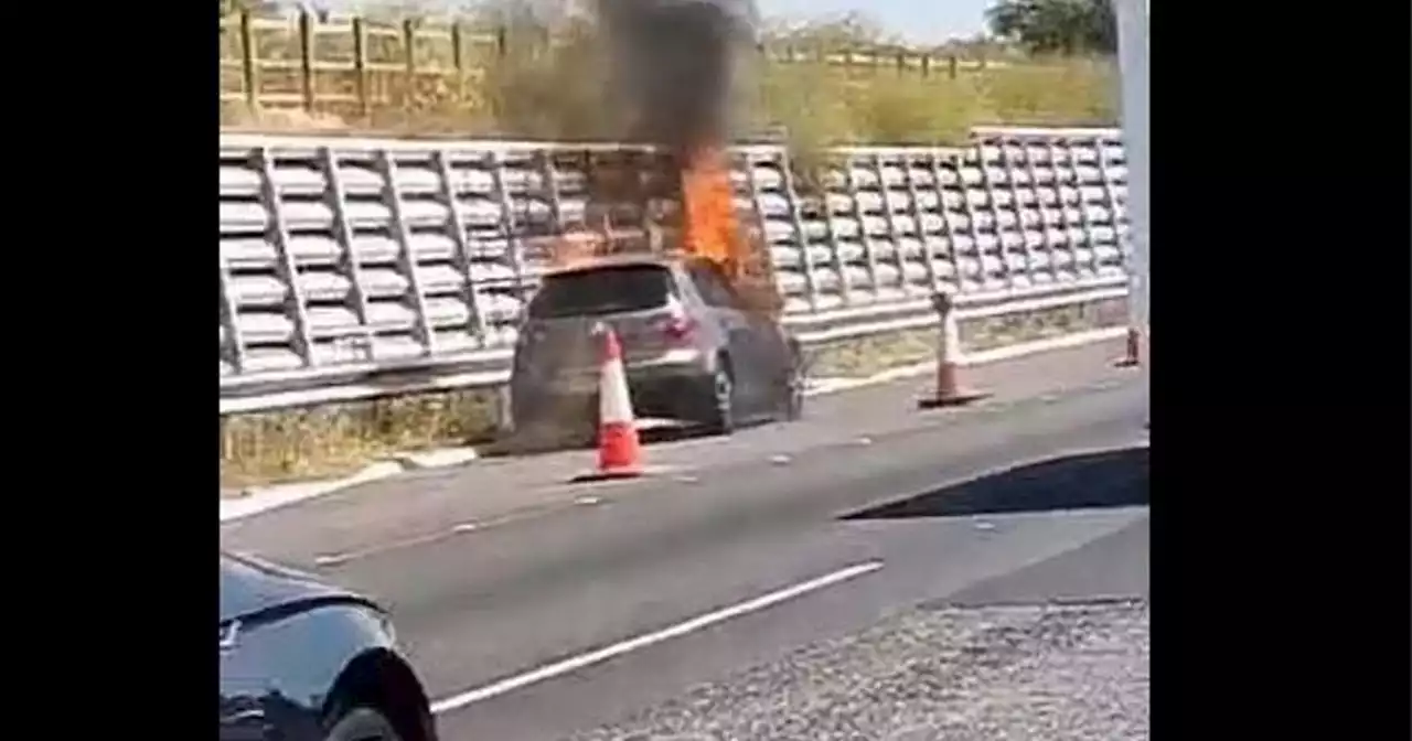 Car fire on M56 motorway near Manchester Airport leads to miles of congestion