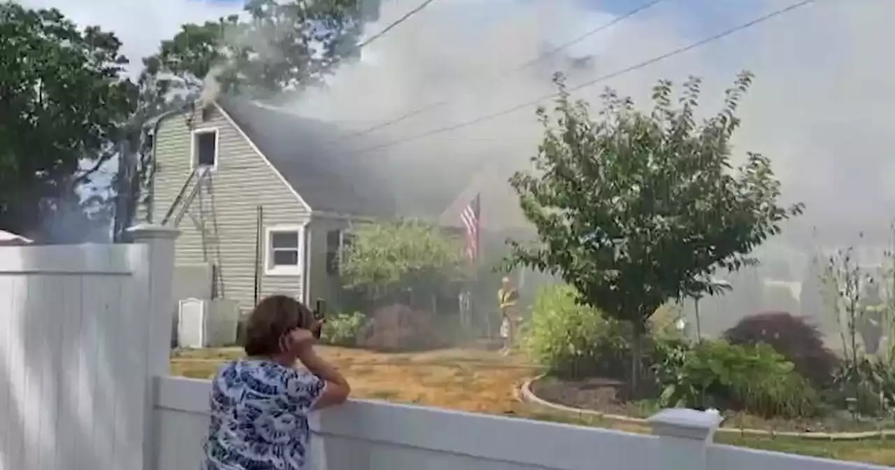 Firefighters lauded for rescuing Islip Terrace woman, 3 dogs from house fire