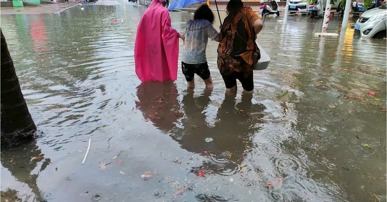 China lashed by year's first typhoon, record rains forecast