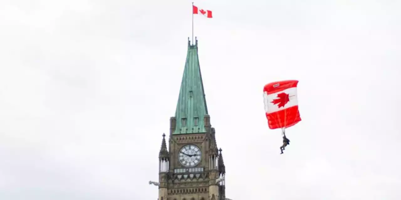 Festive, muted atmosphere in Ottawa as thousands flock to LeBreton Flats, and heavily secured Parliament Hill for first in-person Canada Day in two years