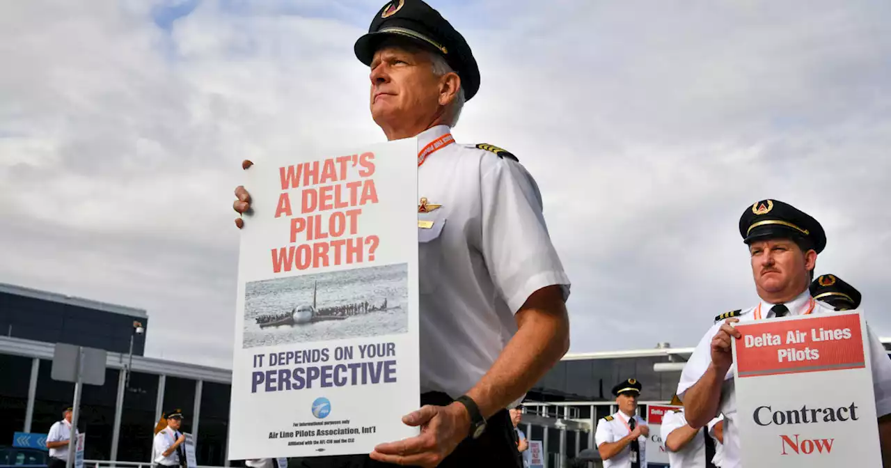 Delta pilots picket ahead of the busy Fourth of July travel weekend