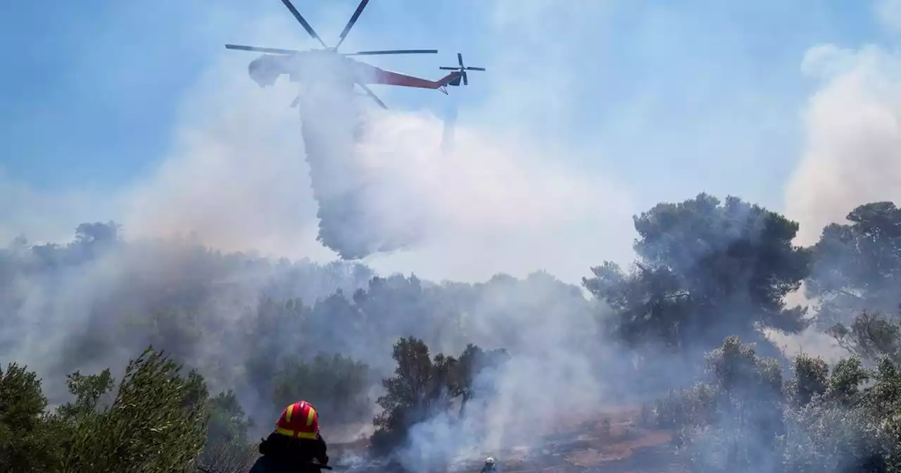 As fires ease in southern Europe, blaze hits Greek capital