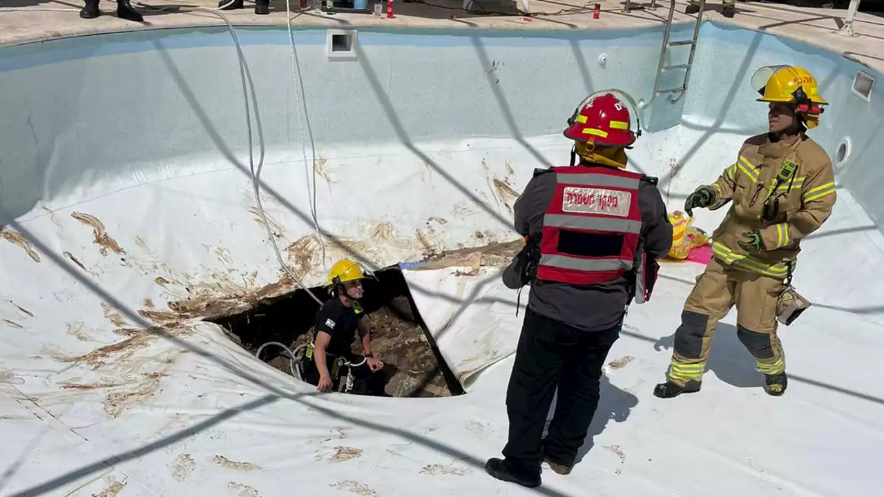 Man found dead after being swept into sinkhole that opened up underneath pool