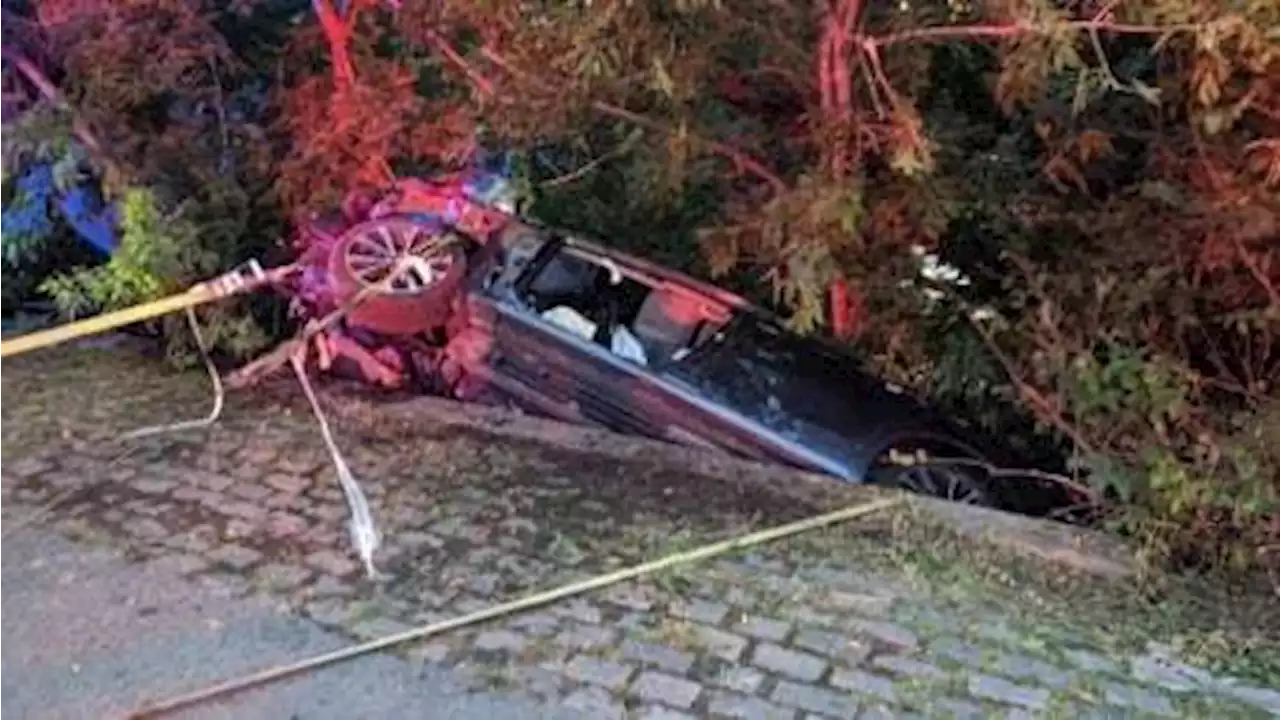 Firefighters rescue unconscious driver, stop car from falling into river | CBC News