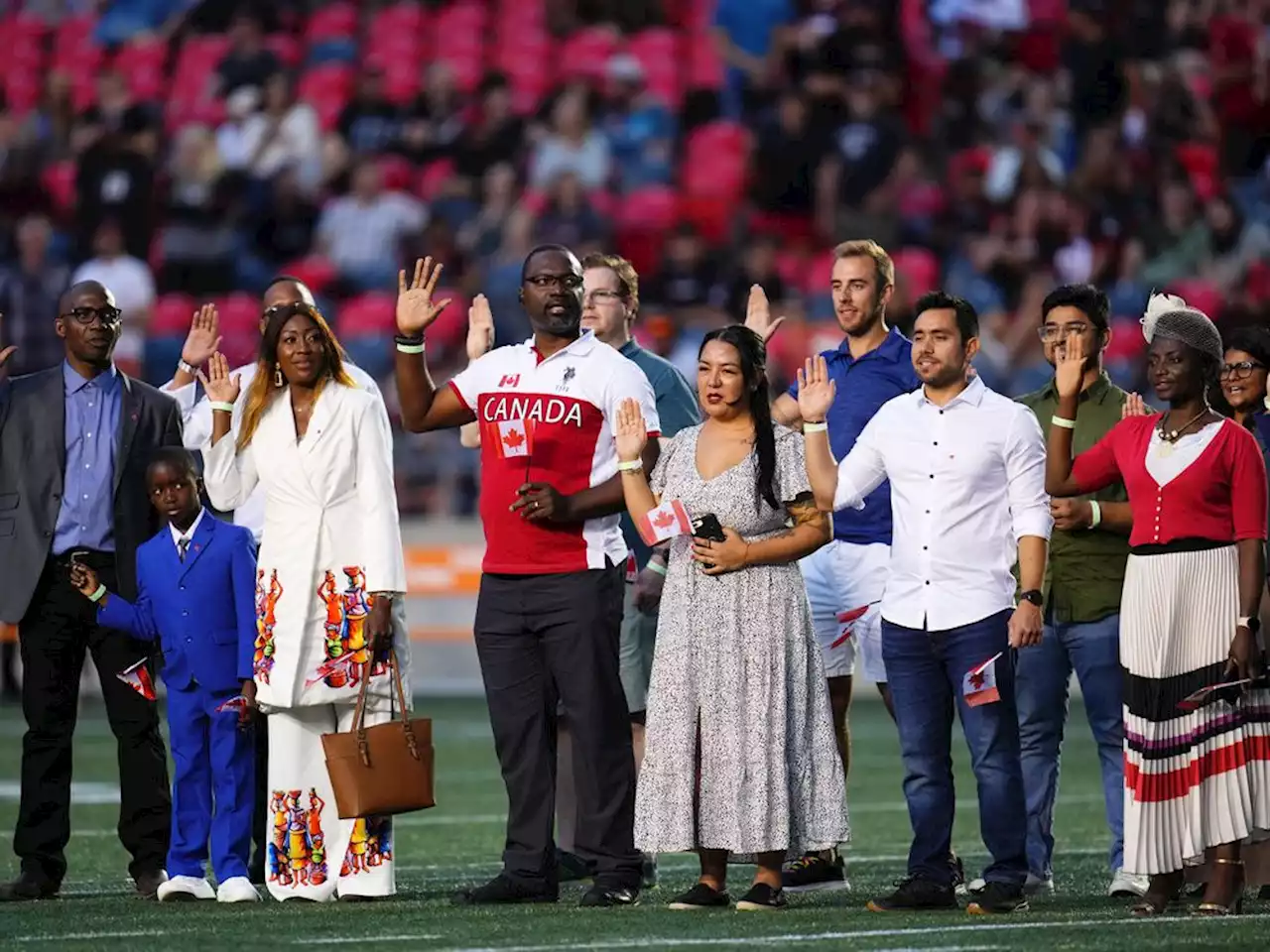 What it's like to become a new Canadian citizen — at centre field, in the middle of a CFL game