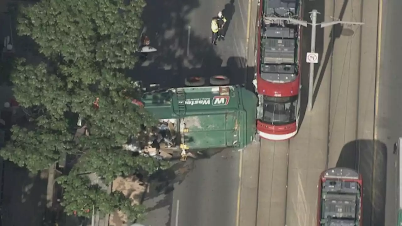 Two people injured after streetcar crashes into garbage truck in Toronto: police