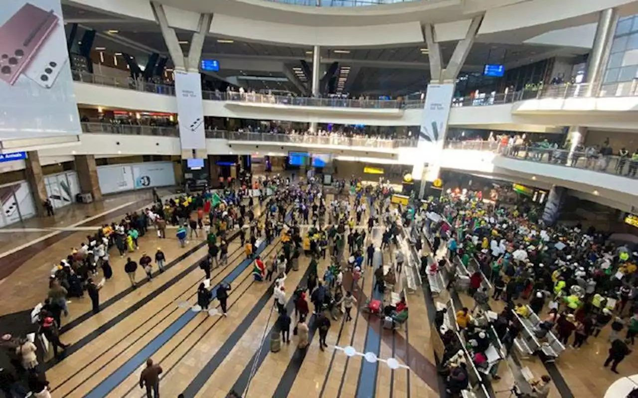 Scores of fans gather at OR Tambo International Airport to welcome Banyana home