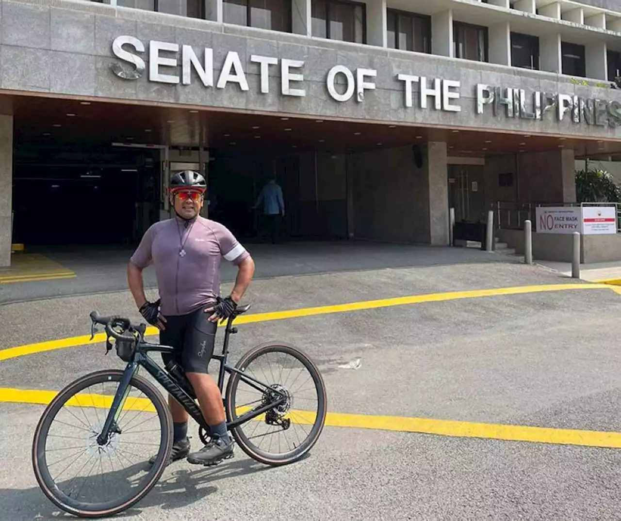 Sen. JV Ejercito rides to work on a bike