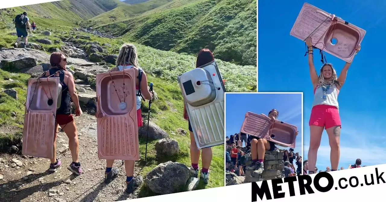 Women climb Scafell Pike with kitchen sinks on their backs to fight gender norms