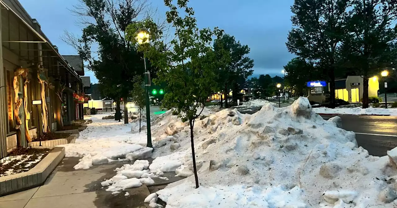 Piles of pebble-sized hail in Estes Park, dumping rain across state