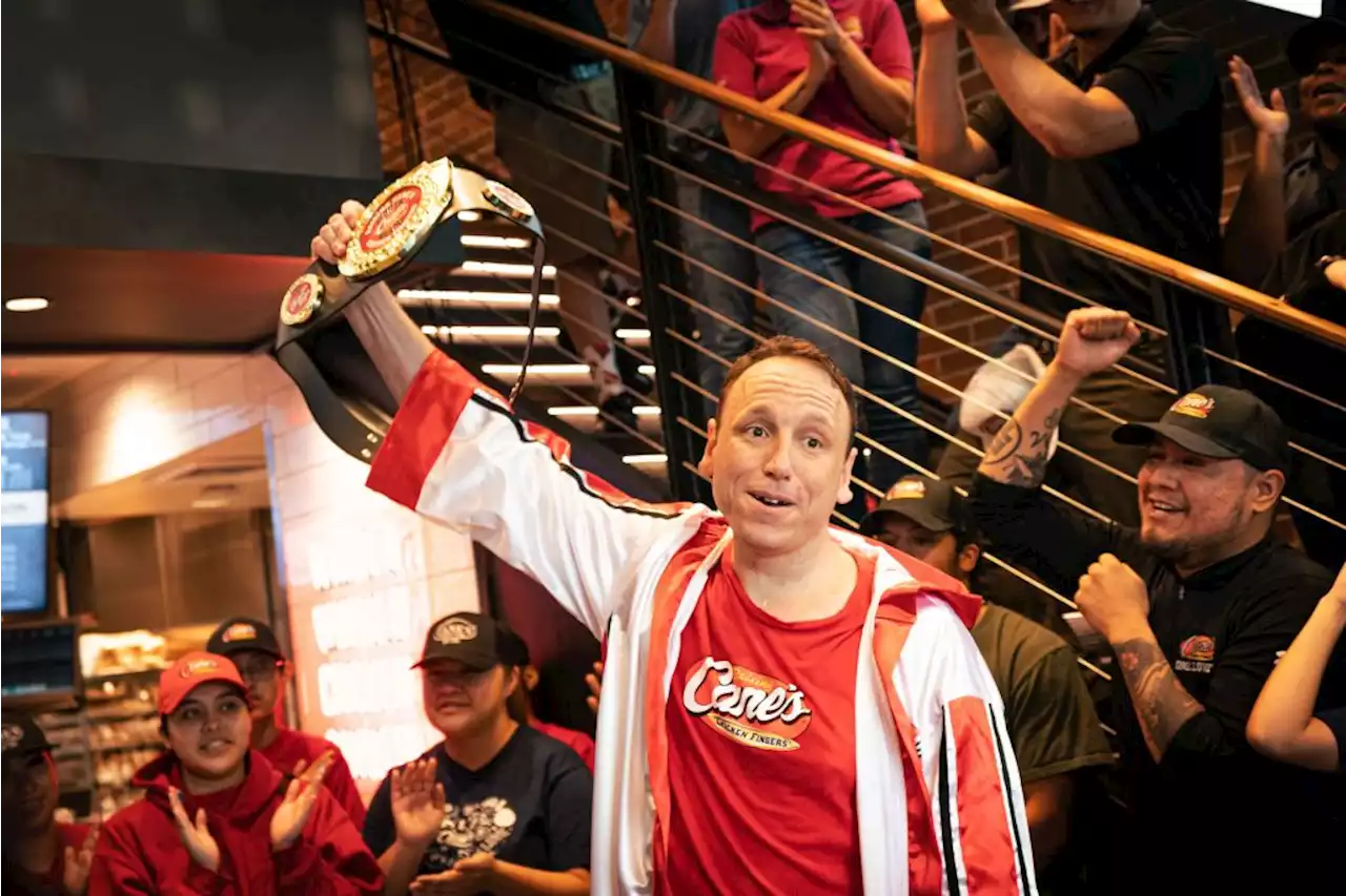 Hot dog! Joey Chestnut sets a Raising Cane’s chicken-eating record