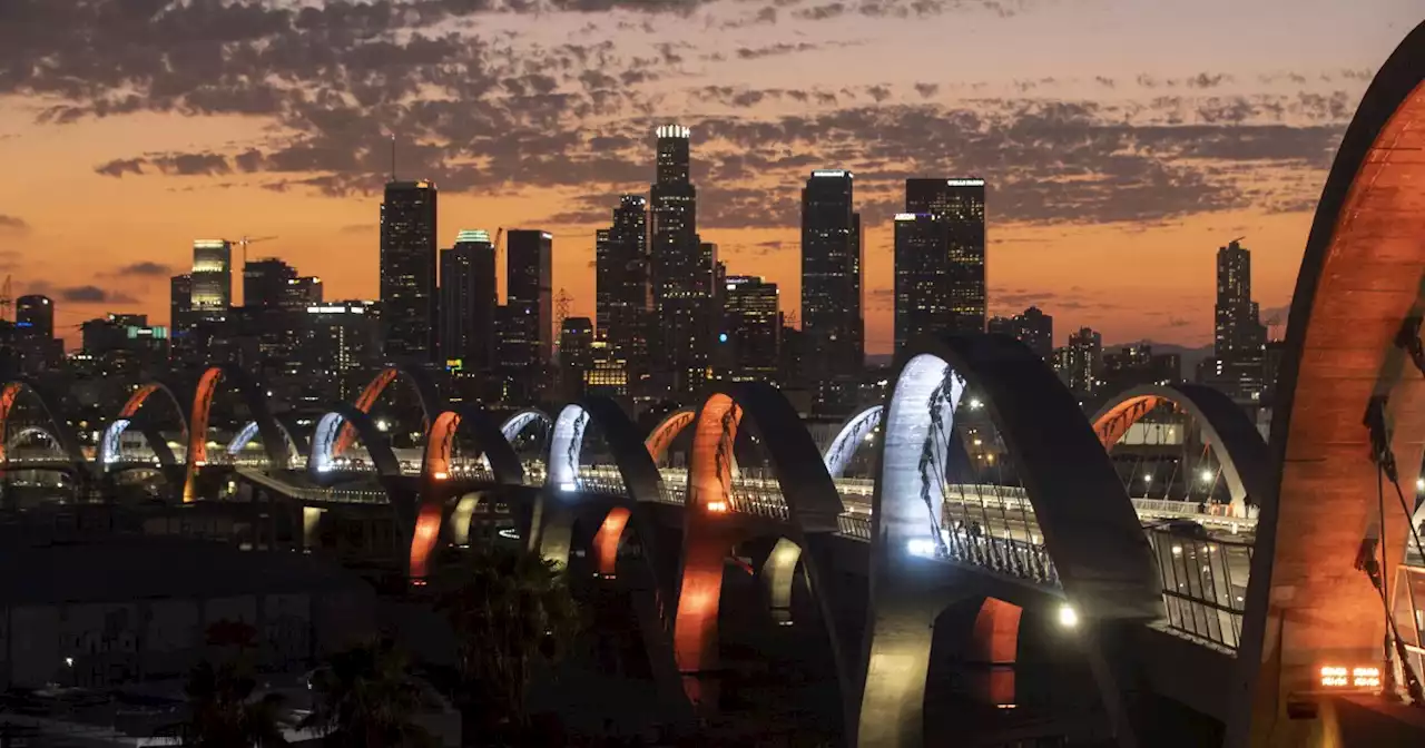 'It’s our bridge': A night of selfies, Modelos, cops, dogs and a cat on the 6th Street Viaduct