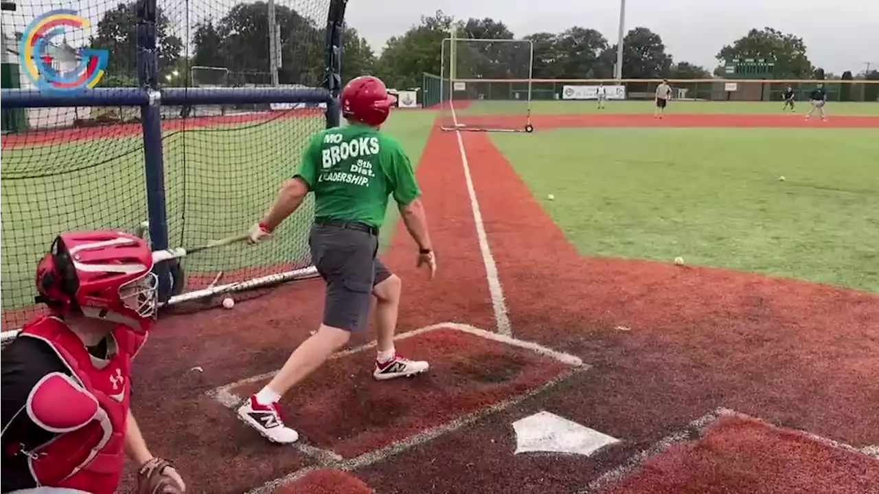 Alabama Rep. Mo Brooks gives up bills for bats at the Congressional Baseball Game