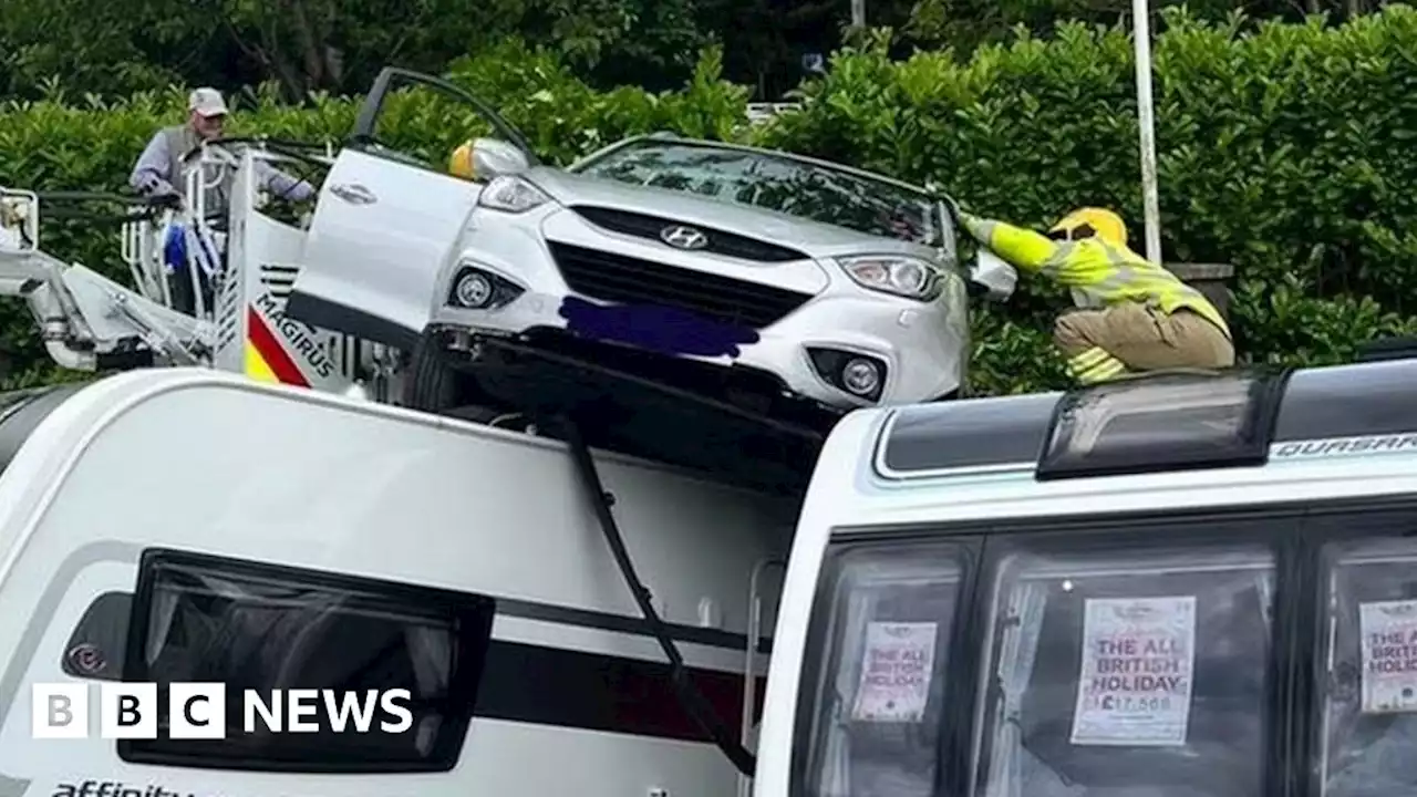 Car lands on top of caravans after Glossop collision