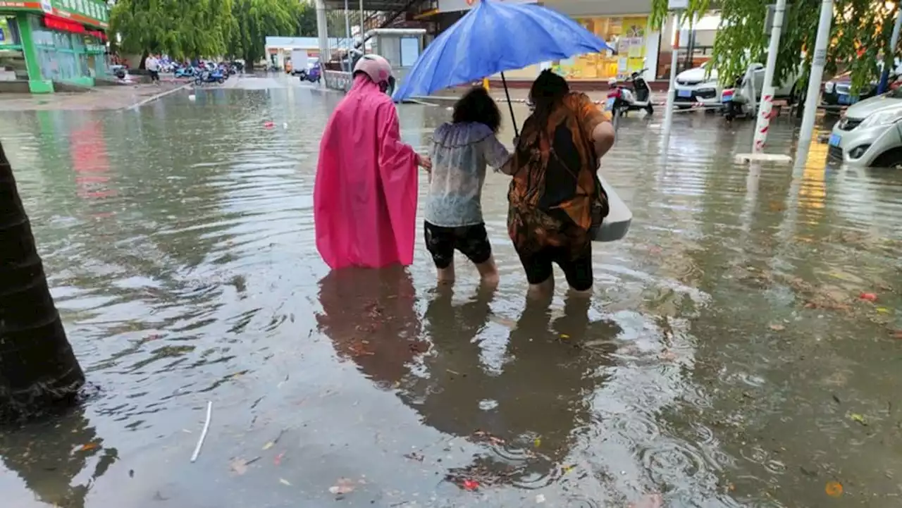 China lashed by year's first typhoon, record rains forecast